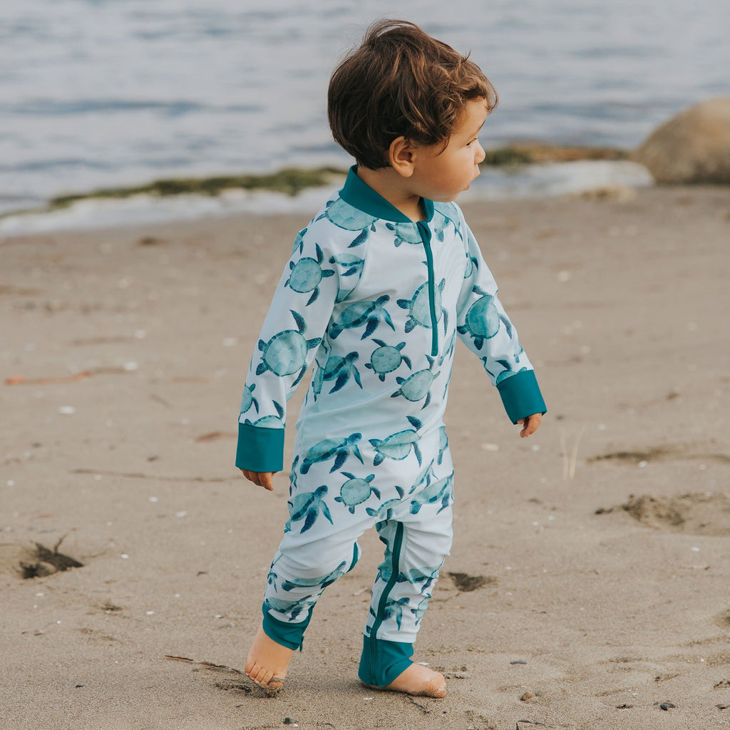 UPF 50+ protective full length, long sleeve swimsuit. Turtle print with zipper. 
